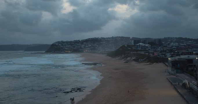 Dark and gloomy sky filled with grey clouds over Bar Beach, Newcastle, New South Wales, Australia