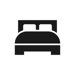 Bed with pillows simple black vector icon. Hotel or hostel symbol.