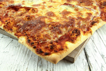 large rectangular pizza lying on a table