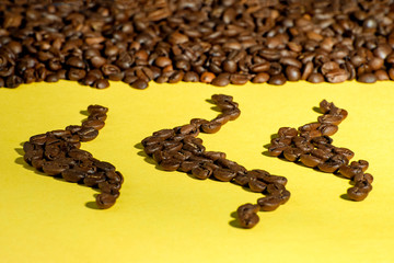 Abstract combination of coffee beans on a yellow background