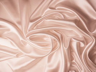 Beautiful smooth elegant wavy beige / light brown satin silk luxury cloth fabric texture, abstract background design. Copy space. Card or banner