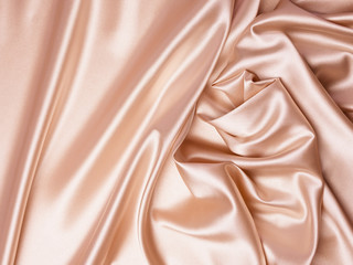 Fototapeta premium Beautiful smooth elegant wavy beige / light brown satin silk luxury cloth fabric texture, abstract background design. Copy space. Card or banner