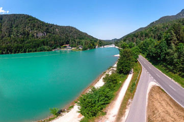 Fototapeta na wymiar Lake Saalachsee in the Bavarian Alps. Aerial wide panorama view of beautiful landscape with lake turquoise color. Schneizlreuth Germany. Travel and vacation concept. copy space