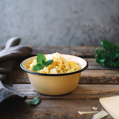 Cream risotto on rustic wooden table