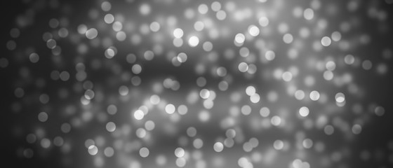 Beautiful black bokeh background. Bright light effect. Glowing particles on a colored background. 