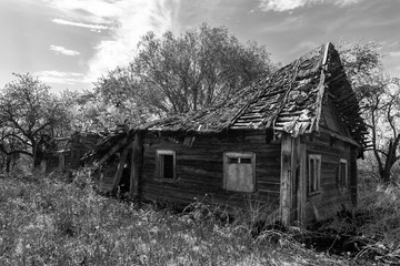 Abandoned and ruined wooden house in the village