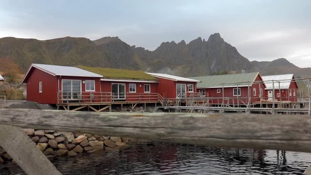 Slider shot of a red lodge in Ballstad, Lofoten, Norway