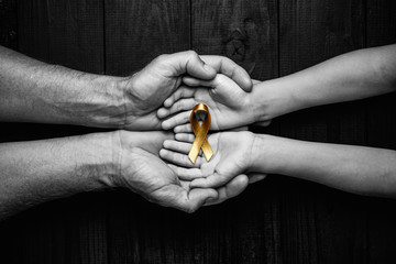 golden ribbon childhood symbol
