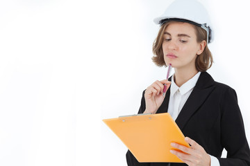 A beautiful business woman in a suit is using ideas to hold a writing board and a pen while thinking with determination on a white background in the concept of business success and career progress.