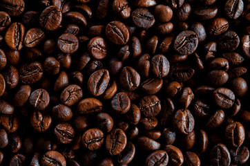 Roasted coffee beans as backgroundon the table