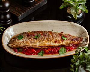 fried whole fish served in sour souce, garnished with herbs