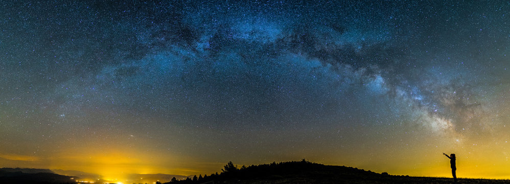 Milky way and girl in Montsec, Lleida, Pyrenees, Catalonia, Spain