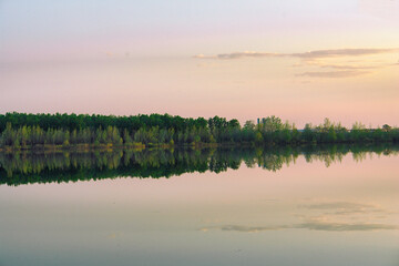 Naklejka na ściany i meble Large lake or river in good Sunny calm weather. Evening on the lake