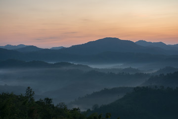 A picture of beautiful sky and cover foggy of layer mountain before sunrise, Thailand.