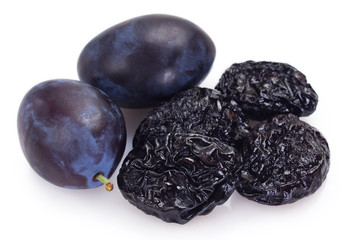 Fresh plums with prunes on white background