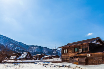 The view around the Shirakawago village, Antique style wooden house, World heritage village during the winter season with the clear blue sky and snow, Gifu, Japan