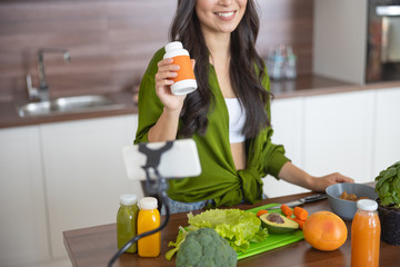 Smiling young blogger talking about healthy diet