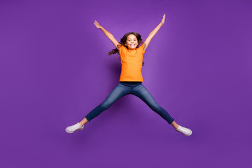 Fototapeta na wymiar Full length body size view of nice attractive lovely cute cheerful cheery wavy-haired girl jumping having fun spring time isolated on lilac purple violet pastel color background