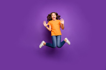 Fototapeta na wymiar Full length body size view of her she nice attractive crazy foolish playful funky cheerful cheery wavy-haired girl jumping having fun fooling isolated on lilac purple violet pastel color background