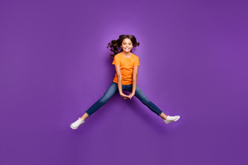 Fototapeta na wymiar Full length body size view of her she nice attractive lovely pretty winsome cheerful cheery wavy-haired girl jumping having fun isolated over lilac purple violet pastel color background