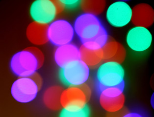 Colorful bokeh lights on black background On christmas day.