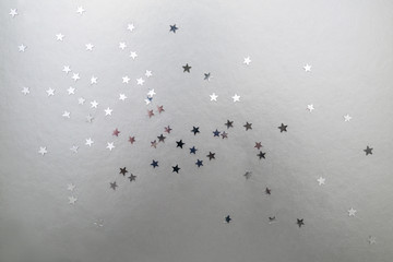 Silver stars on a silver background.