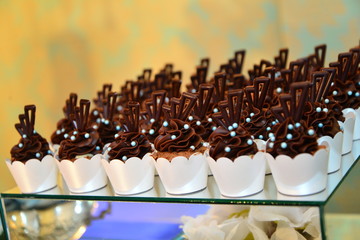 sweets on the table, cupcakes on the table, condensed milk candy , chocolate truffles, brigadeiro, chocolate sprinkles, chocolate candy