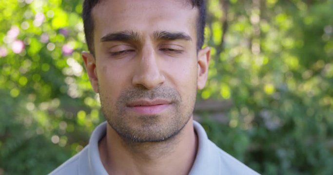 Close Up - Handsome man looks into the camera with a straight face - Slow Motion - shot on RED