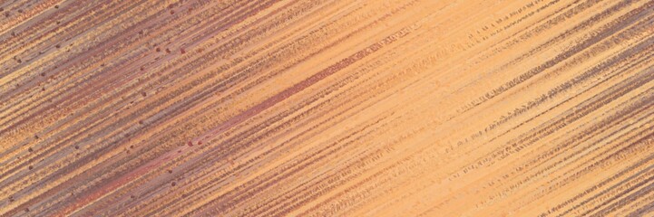 seamless pattern graphic with diagonal color lines background dark salmon, pastel brown and burly wood colors