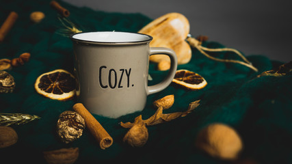 'Cozy' beverage mug on merino wool blanket,  fall spices and wooden heart decoration