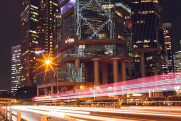Fototapeta na wymiar Night traffic of cars on the background of skyscrapers