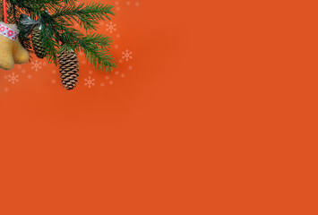 Orange background for a letter to Santa Claus. Background for a Christmas card. Decorated with fir cones, fir branches, snowflakes, Christmas toys.