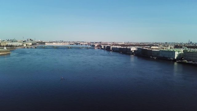 Bright aerial view of the Neva river, Saint Petersburg, Russia at sunny day. Stock footage. Neva river with bridges and embankment, historical city center,