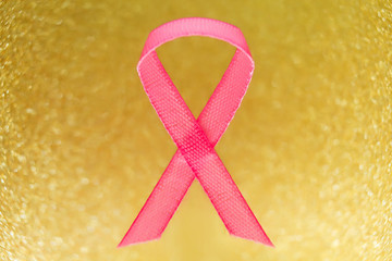 Pink ribbon for breast cancer awareness, symbolic bow color raising awareness on people living with...
