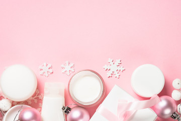 Obraz na płótnie Canvas Winter cream for skin on pink top view.