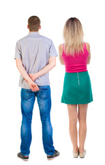 Back view of couple. beautiful friendly girl and guy together.