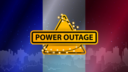 Power outage, yellow warning sign wrapped with garland on the background of the flag of France with the silhouette of the city on the background