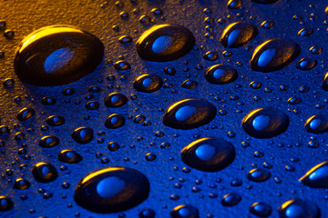 Water droplets on blue background