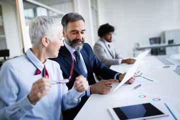 Fototapeta premium Collaboration and analysis by business people working in office