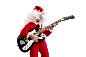 Fototapeta premium Boy dressed as Santa Claus with a guitar on a white background