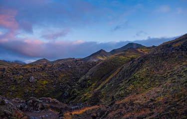 Iceland in september 2019. Great Valley Park Landmannalaugar, surrounded by mountains of rhyolite and unmelted snow. In the valley built large camp. Evening in september 2019