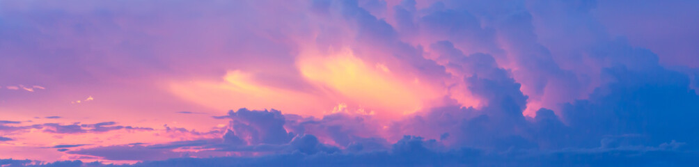 Fantasy colorful background, Gold sunlight on blue sky and moving purple cloud before sunset