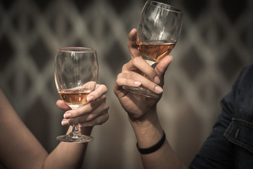Young happy woman drinking holding and drinking a glass of alcohol at night bar or night Club, night party celebrations concept.