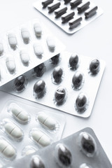 Blisters with pills on white background