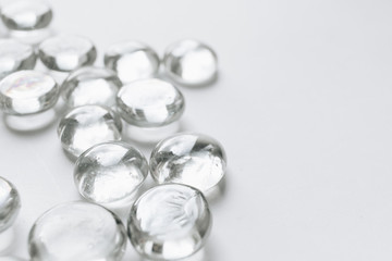 Scattered crystals on white background, beautiful gems