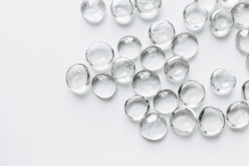 Fototapeta premium Scattered crystals on white background, beautiful gems