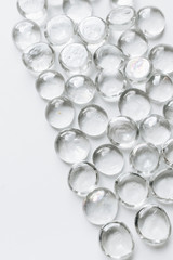 Scattered crystals on white background, beautiful gems