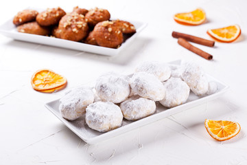 Small Platters Of Homemade Greek Kourabiedes And Melomakarona