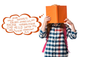 pupil covering face with orange book near greeting lettering on white