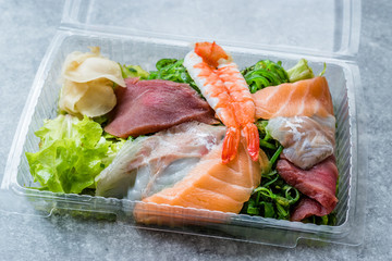 Take Away Sashimi Salad with Wakame, Seaweed, Salmon, Sea Bass, Shrimp, Kani, Mackerel Fish, Tuna in Plastic Box Package / Container.